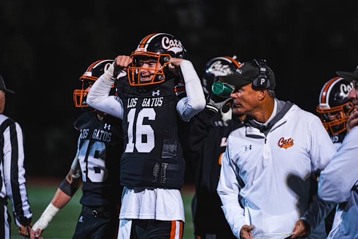 Los Gatos quarterback A.J. Minyard and coach Mark Krail in a win earlier this season over Riordan.